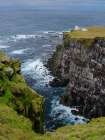 Iceland, cliffs of Latrabjarg and lighthouse Bjargtangar during autumn. Art Print